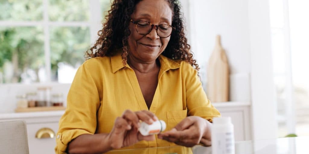 woman taking her medication