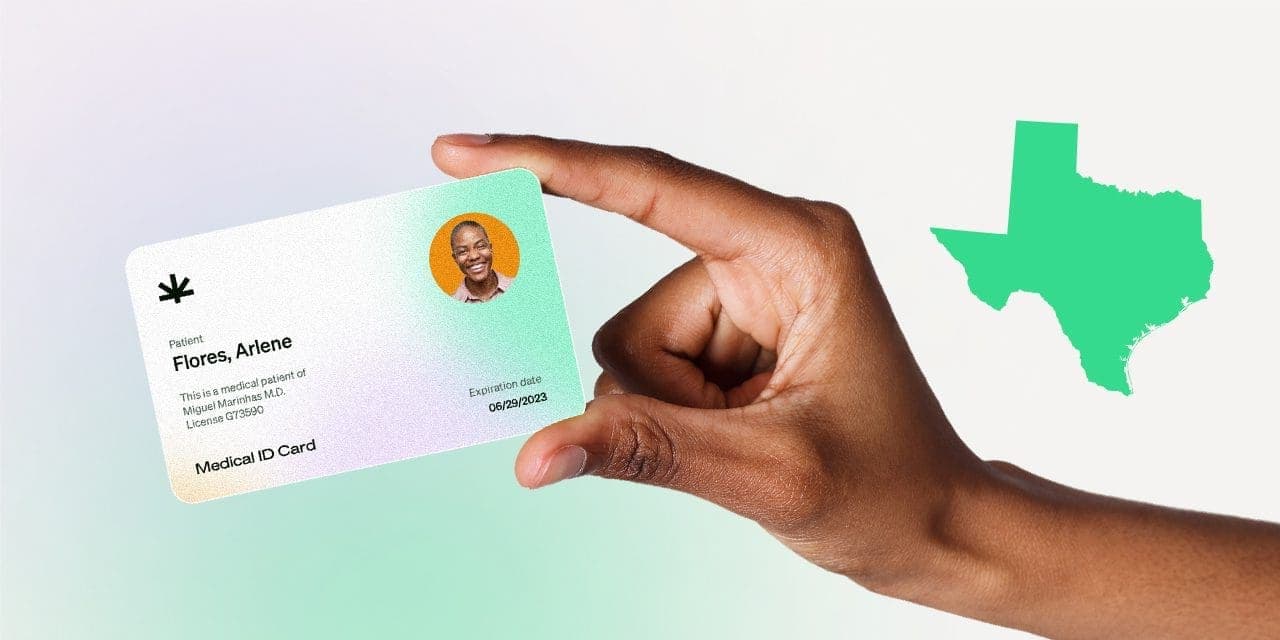 closeup hand holding MMJ card