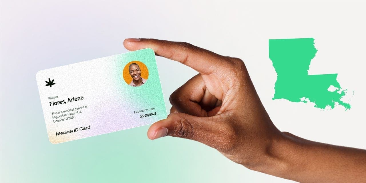 closeup hand holding MMJ card