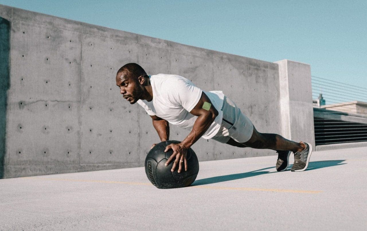 a man working out using a soccer ball