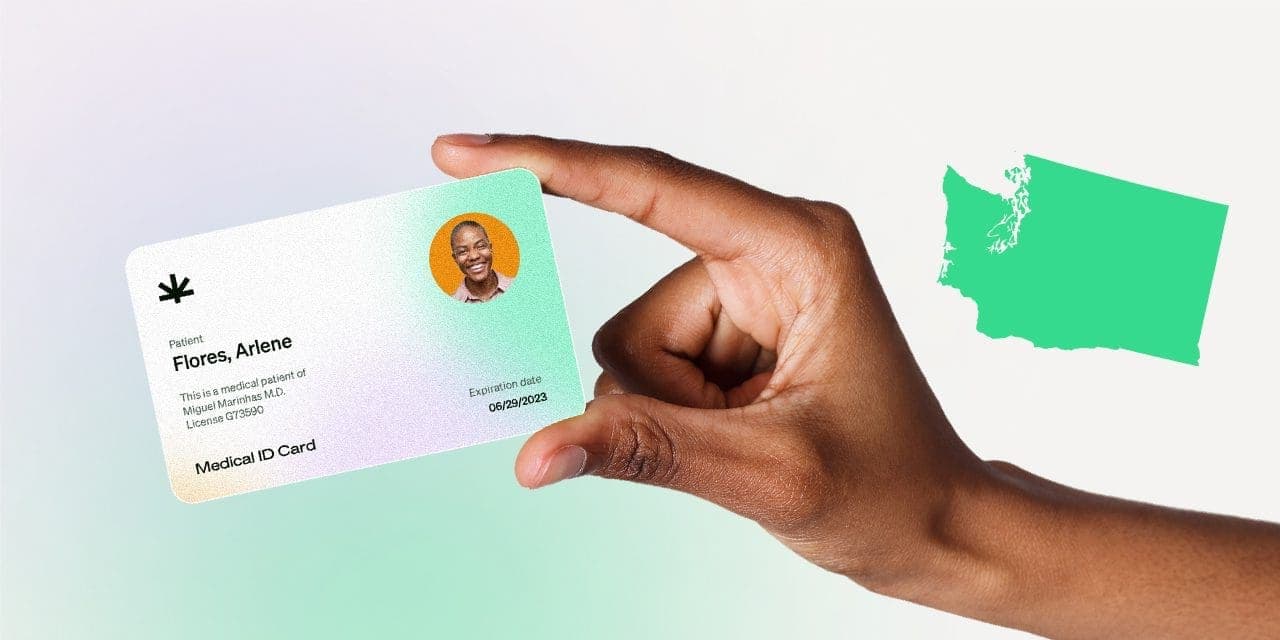 closeup hand holding MMJ card