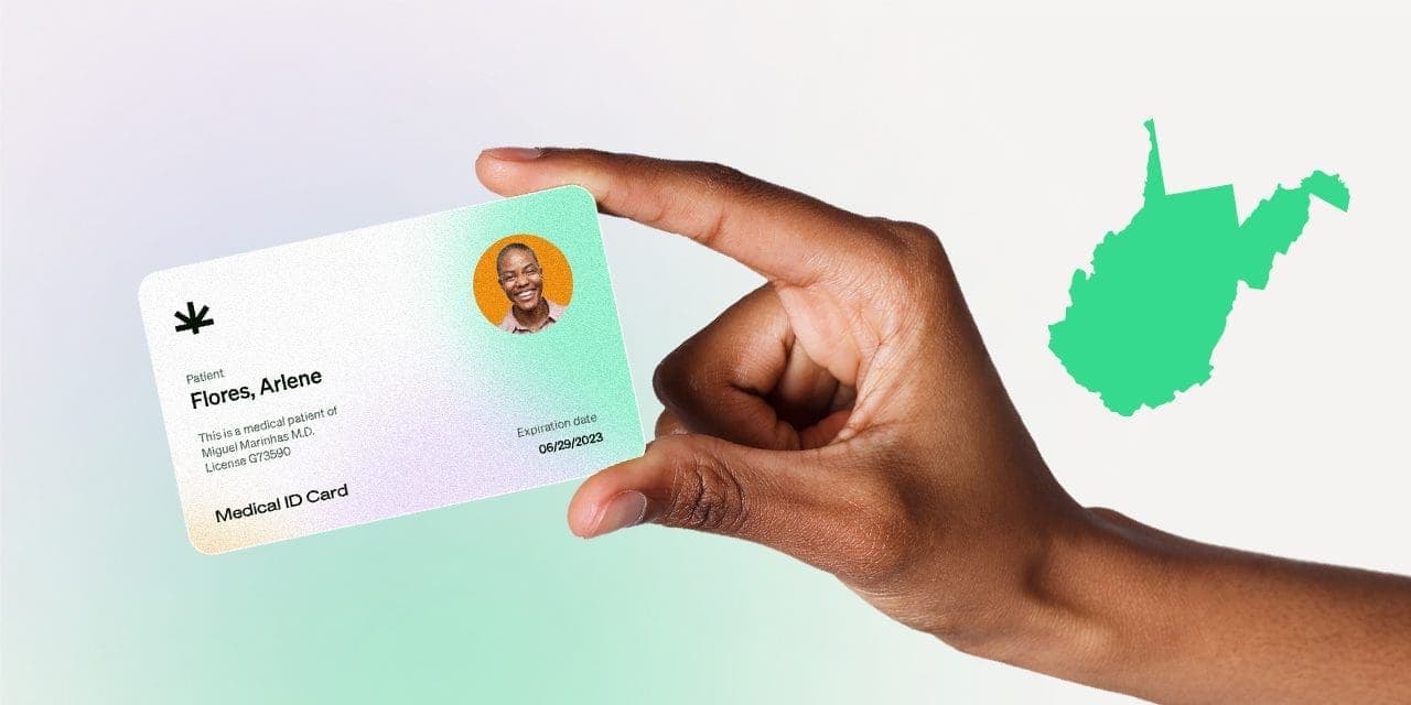 closeup hand holding MMJ card