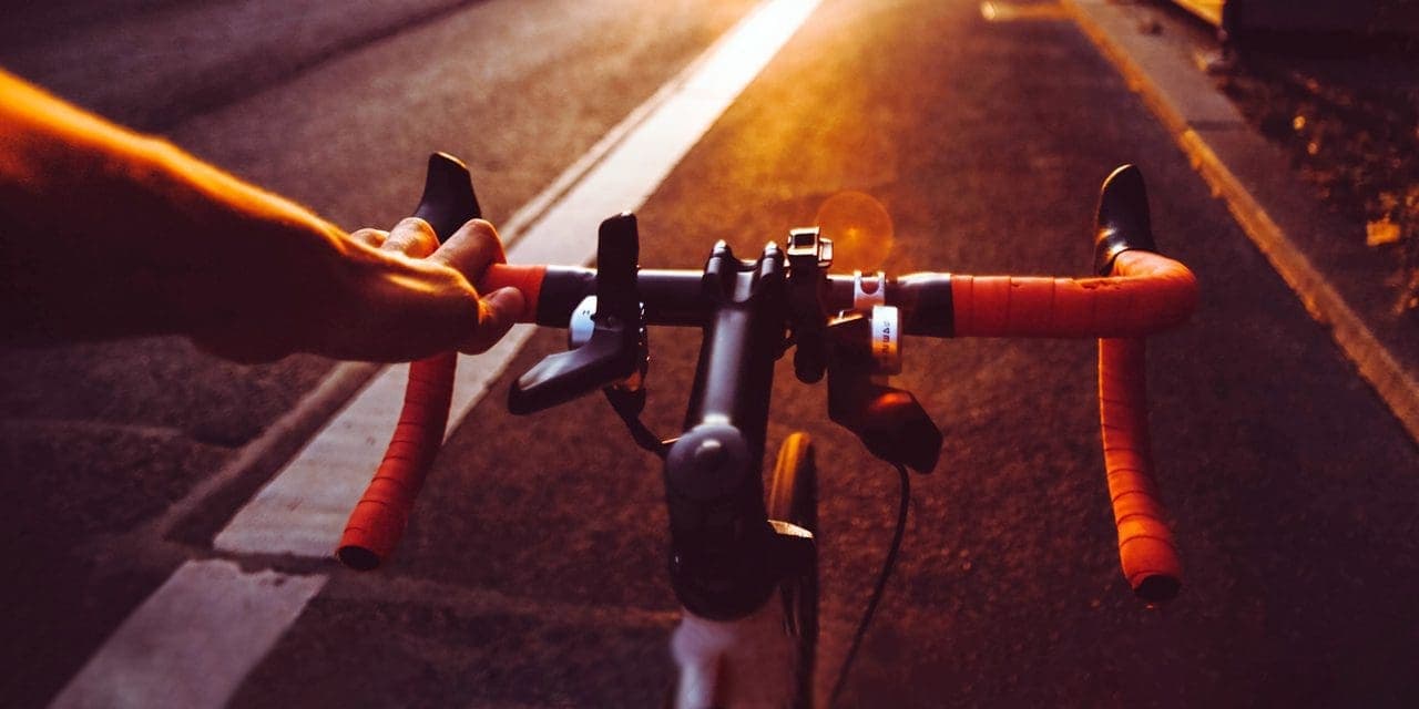 closeup driver's front view of bicycle on a road